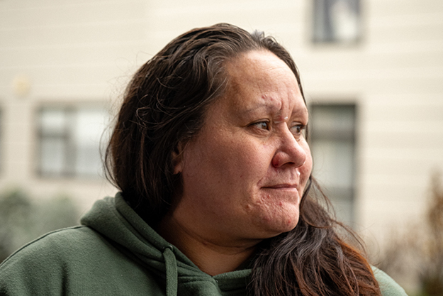 Jasmine outside her home